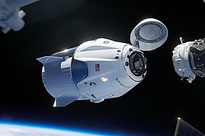 La capsule Crew Dragon sur le point de s'arrimer automatiquement   à la station ISS lors de la mission-test inhabitée Demo-1