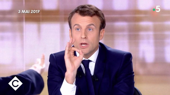 E. Macron face  M. L Pen